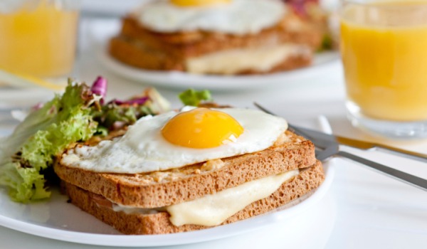 sandwich topped with fried egg makes a great late night snack